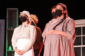 Theater students acting during performance