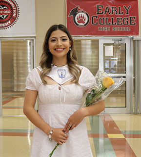 National Honor Society student holding flowers